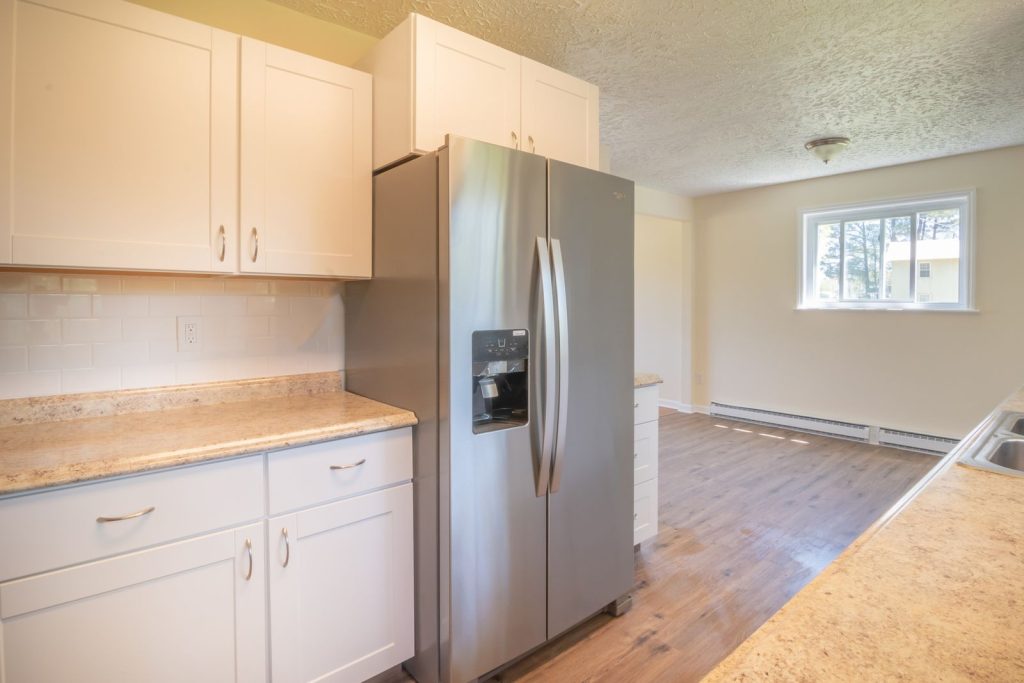 Bright modern kitchen with a stainless steel refrigerator