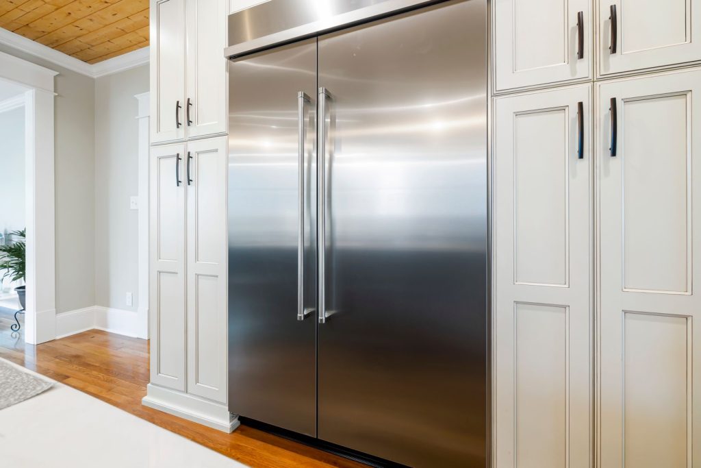 Stainless steel French-door refrigerator in a bright kitchen