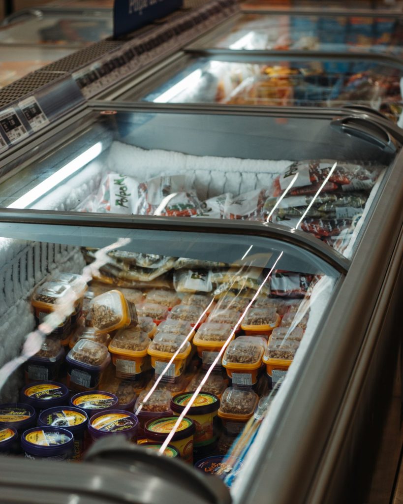 Store freezer filled with packaged ice cream